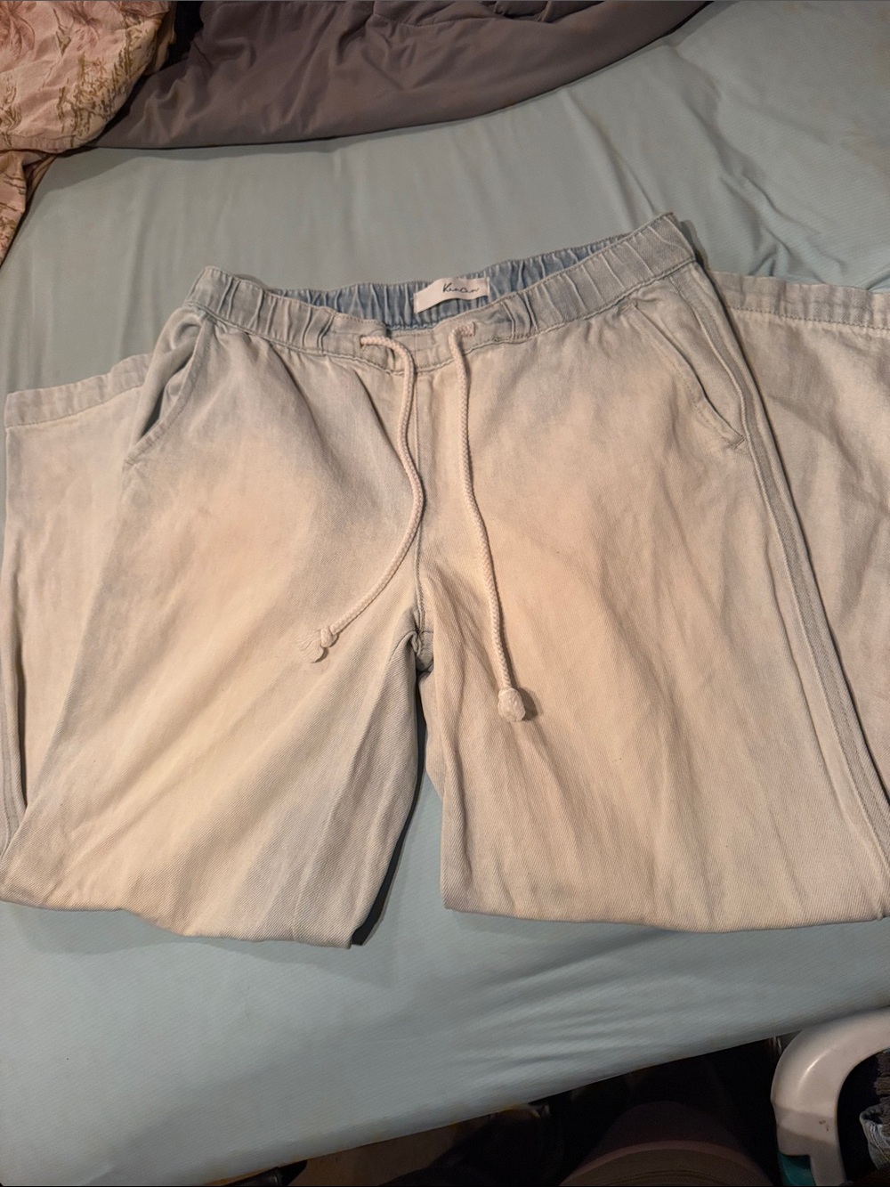 KanCan light washed soft, Jean-like material with a drawstring waist